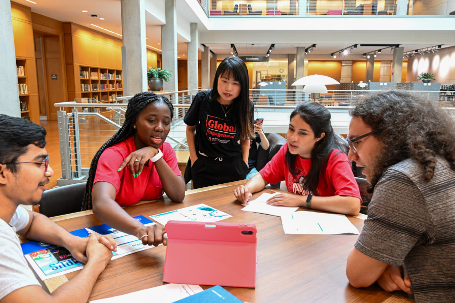 Students studying together in a modern lounge area on campus.